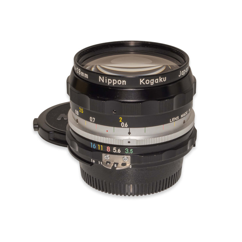 Objectif NIKON Nikkor-H Auto - 28mm f/3.5 - #314574 avec Objectif NIKON Nikkor-H Auto - 28mm f/3.5 - #314574 avec